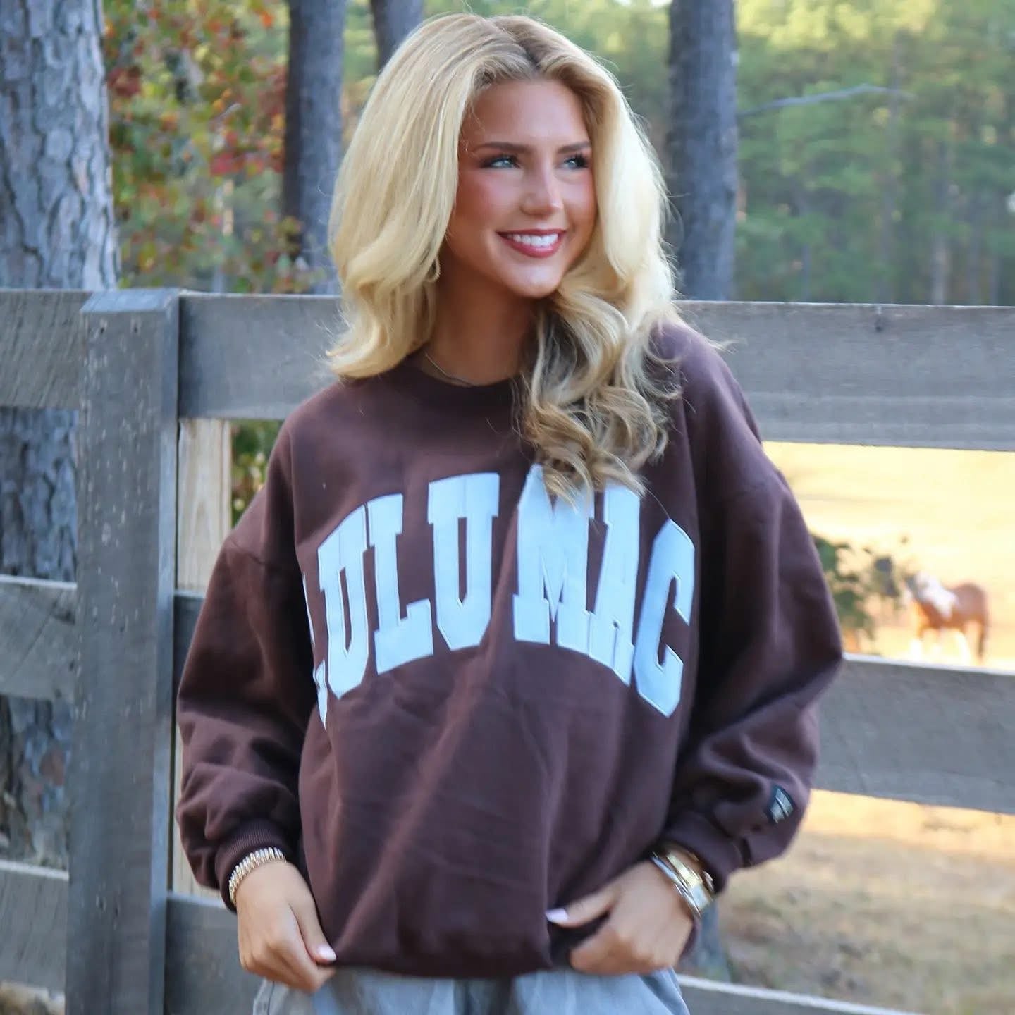 Lulu Mac chocolate brown sweatshirt with blue logo stitch